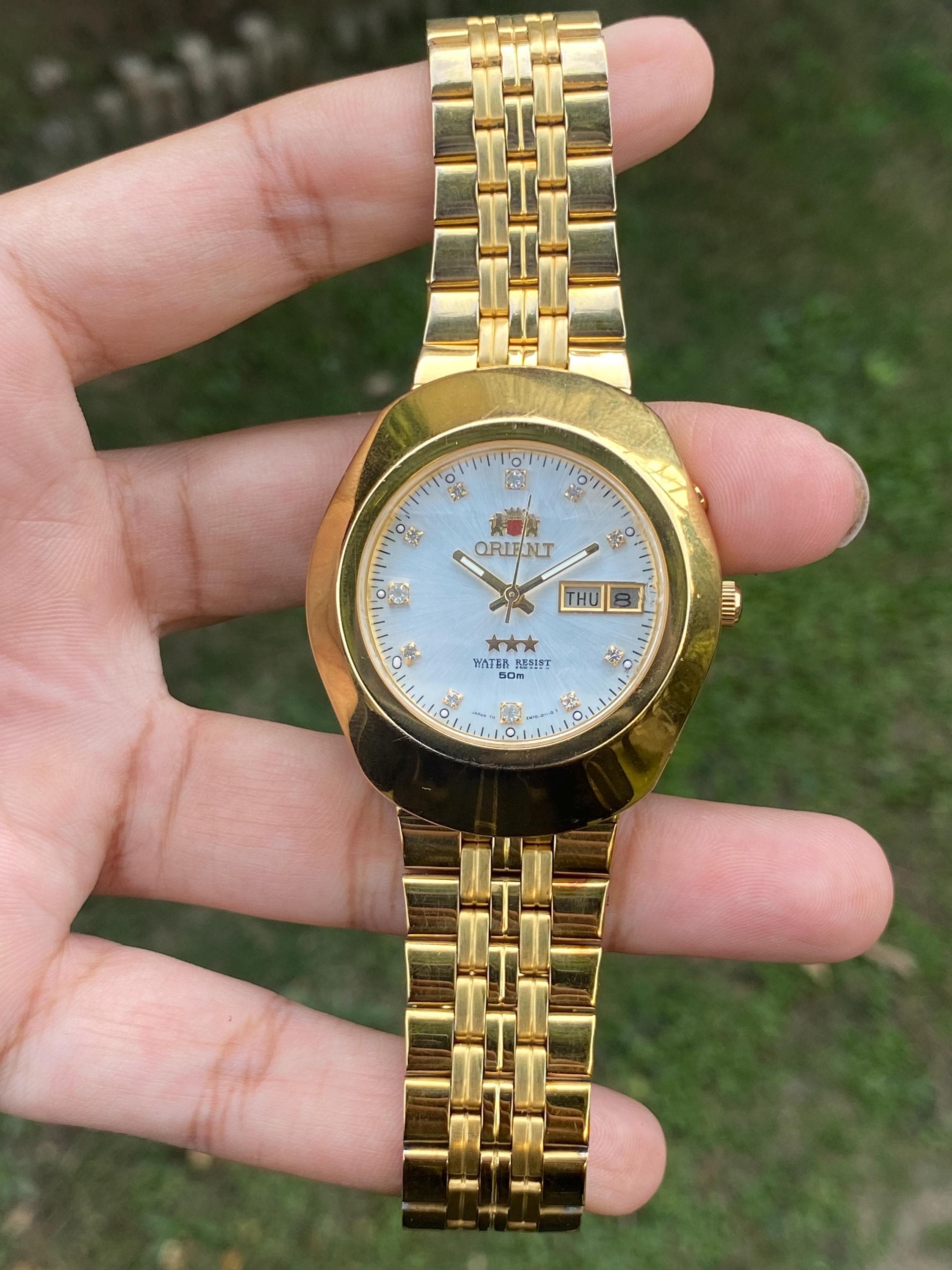 All Authentic Orient 3 Star Automatic EM70-A0-B CA Day/date Gold