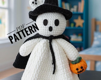 May include: A handmade crochet ghost doll wearing a black witch hat and cape, holding a small orange pumpkin. The ghost has black eyes and a mouth. The doll is white and has the text "PDF PATTERN" on it.
