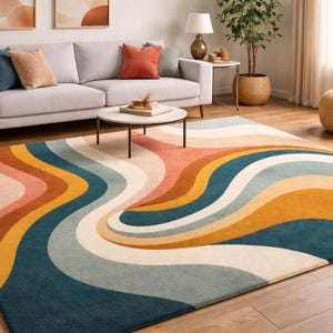May include: A large area rug with a retro design. The rug features a wavy pattern in shades of blue, orange, yellow, and cream. The rug is placed on a hardwood floor in a living room setting.