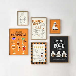 May include: A gallery wall set of six framed Halloween-themed art prints. Designs include dancing skeletons, a Pumpkin Spice Club poster, a ghost with a pumpkin, Midnight Margaritas cocktails, a five-star ghost review, and Freshly Boo'd Coffee.
