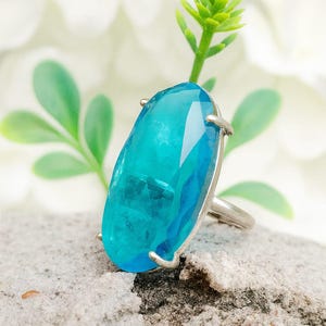 Elegant Oval Blue Topaz Statement Ring in Silver Setting