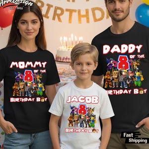 May include: Family birthday shirts. The black shirts say "Mommy of the 8 Birthday Boy" and "Daddy of the 8 Birthday Boy". The white shirt says "Jacob 8 Birthday Boy". Each shirt has a graphic of characters.