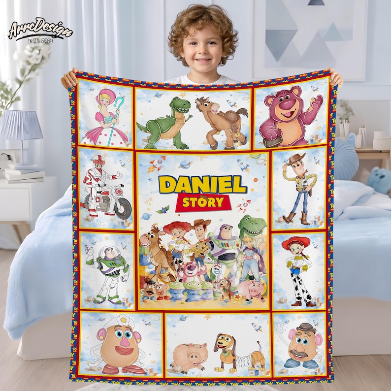 May include: A colorful blanket featuring characters from the "Toy Story" movie, including Woody, Buzz Lightyear, and others. The blanket has a personalized "Daniel Story" design. The border is red and blue, with a white background.