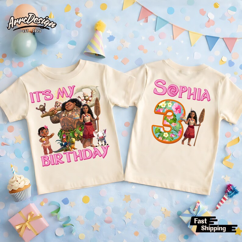 May include: Two cream-colored t-shirts with colorful graphics. One shirt says "IT'S MY BIRTHDAY" with a cartoon image. The other shirt says "Sophia 3" with a floral design. Both shirts are short-sleeved.