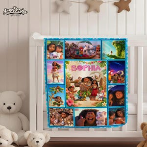 May include: A personalized baby blanket featuring a collage of images from the animated movie "Moana." The blanket has a blue border and includes the name "Sophia" in pink letters. The design incorporates various characters and scenes from the film.