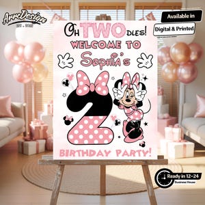 May include: A pink and white birthday party sign featuring Minnie Mouse. The sign says "Oh Two Dles! Welcome to Sophia's Birthday Party!" and includes a large number 2 with polka dots. The sign is on an easel.