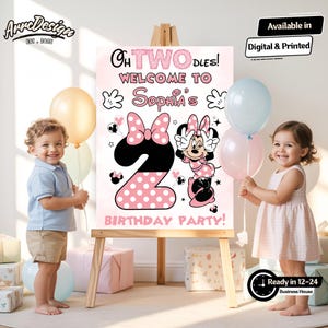 May include: A pink and black birthday party sign with the text "Oh Twodles! Welcome to Sophia's Birthday Party!" features a Minnie Mouse design and the number 2. The sign is displayed on an easel, with two children and balloons in the image.