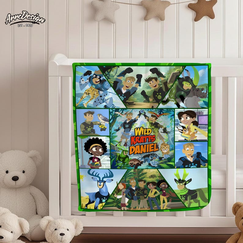 May include: A green-bordered baby blanket featuring a colorful design with characters and the text "Wild Kratts Daniel." The blanket is decorated with various animal illustrations and cartoon characters.