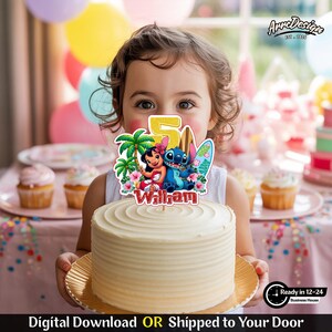 May include: A white frosted cake with a decorative topper featuring the characters Lilo and Stitch, a surfboard, and the number 5. The topper also includes the name "Wilham". The cake is on a gold-colored plate. The image includes text that says "Digital Download OR Shipped to Your Door".
