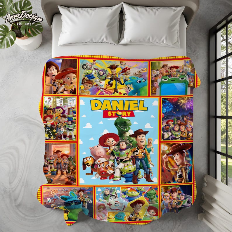 May include: A personalized blanket featuring characters from the animated film "Toy Story." The design includes a central panel with the name "DANIEL" and various character illustrations, surrounded by a red border.