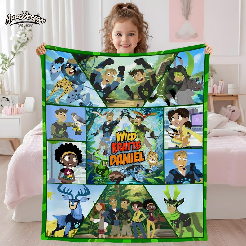 May include: A green and blue Wild Kratts blanket featuring cartoon characters and animals. The blanket has a green border and the text "Wild Kratts Daniel". The blanket is held up by a young girl.