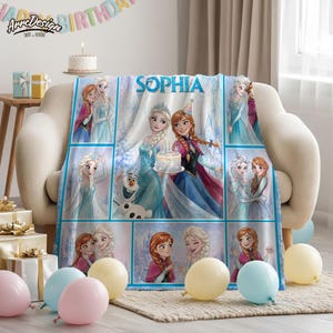 May include: A soft fleece blanket featuring a collage of Frozen characters Elsa, Anna, and Olaf, with the name SOPHIA printed in blue letters at the top. The design includes multiple panels showing the characters in various poses, with light blue and white winter-themed backgrounds.