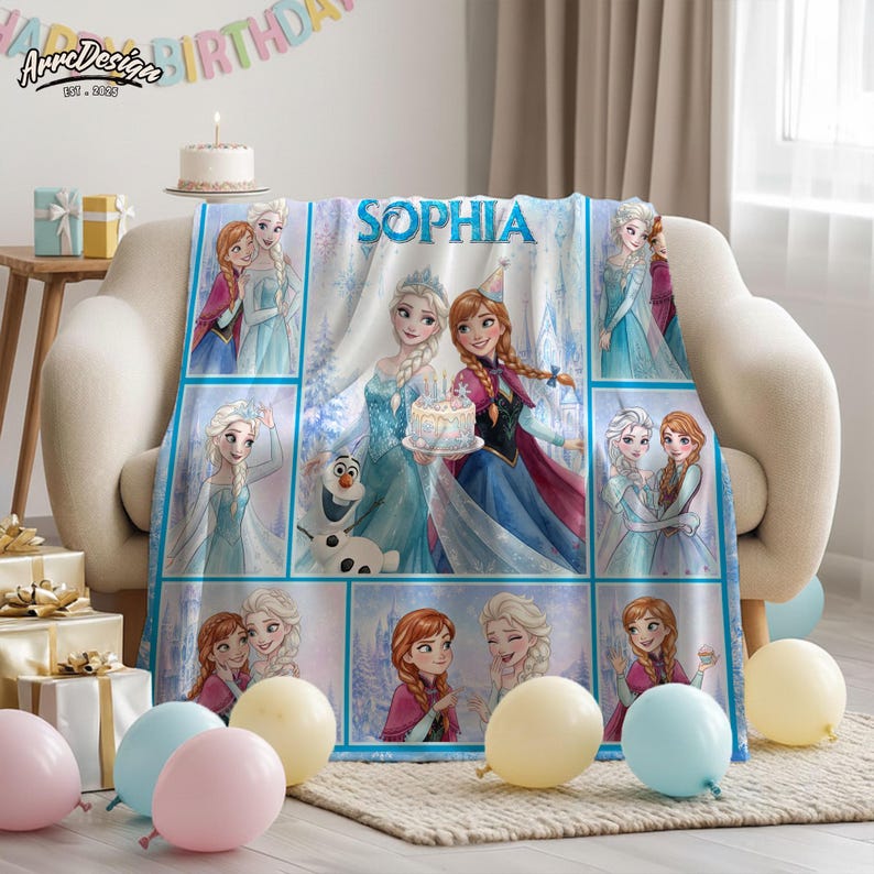 May include: A soft fleece blanket featuring a collage of Frozen characters Elsa, Anna, and Olaf, with the name SOPHIA printed in blue letters at the top. The design includes multiple panels showing the characters in various poses, with light blue and white winter-themed backgrounds.