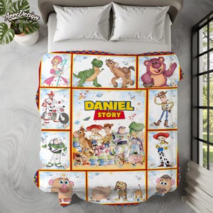 May include: A colorful blanket featuring various characters from the "Toy Story" movie franchise. The blanket has a red border and includes the text "DANIEL STORY". The design includes images of Woody, Buzz Lightyear, and other characters.