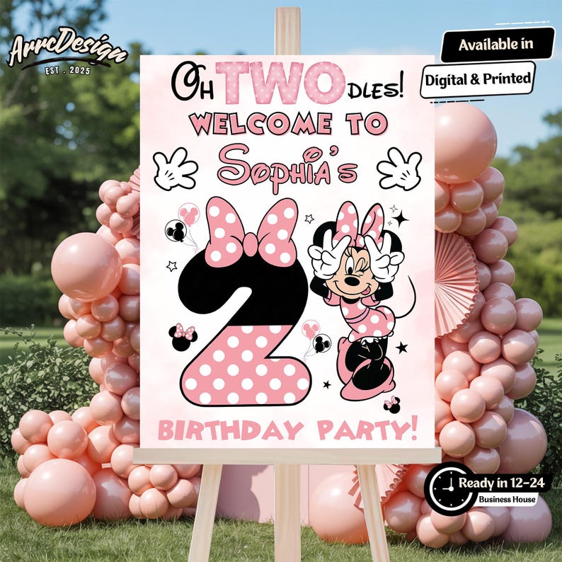 May include: A pink and white birthday party sign featuring Minnie Mouse. The sign says "Oh TWO DLES! Welcome to Sophia's Birthday Party!" and includes a large number 2 with polka dots and a Minnie Mouse illustration. The sign is displayed on an easel.