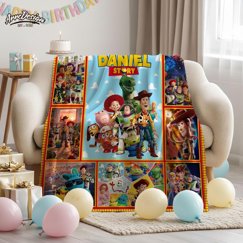 May include: A light blue blanket featuring characters from the movie Toy Story, with the name "DANIEL STORY" printed on it. The blanket is decorated with images of Woody, Buzz Lightyear, and other characters. The blanket is on a beige couch.