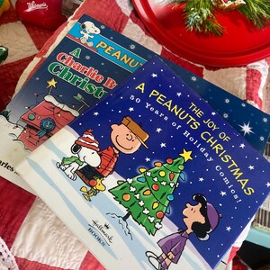 Vintage Books Peanuts A Charlie Brown Christmas Paperback The Joy of a Peanuts Christmas Hardback Dustcover Charles M. Schulz