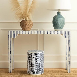 May include: A console table with a blue and white striped design, a matching patterned stool, a teal lamp with a white shade, and a woven vase with dried pampas grass. The table is approximately 100 cm long.