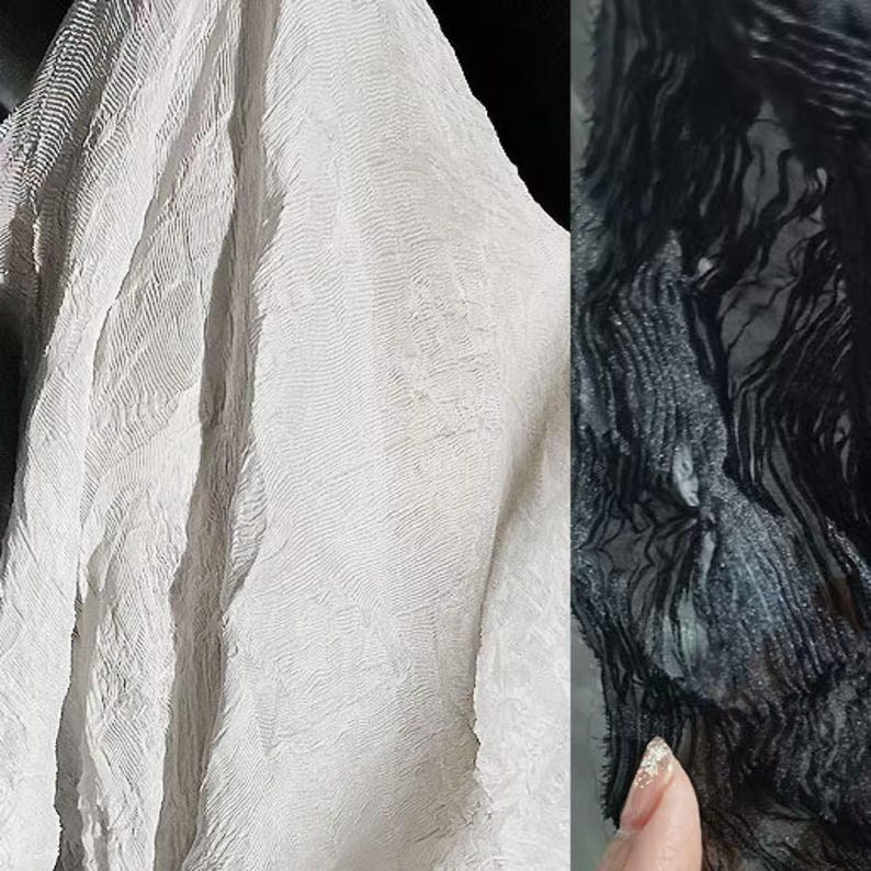 May include: Close-up of two fabrics, one white and one black. The white fabric has a textured, rippled surface. The black fabric has a similar texture, with a fringe-like appearance. The fabrics are likely textiles for clothing or home decor.