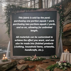May include: A dark chalkboard with white text describing fabric sold by the yard, customizable for various projects like clothing and handicrafts. The board is framed with wood and decorated with greenery and flowers.