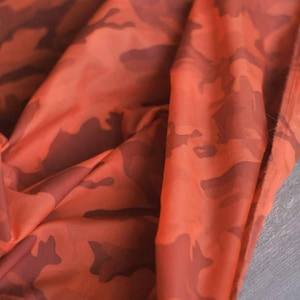 Thermochrome, doorschijnende camouflagestof: patroon-verdwijnen ontwerp voor interactief mode-artistiek decor