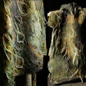 May include: Textured fabric in shades of green, brown, and gray, with white thread-like accents. The fabric appears to be draped, with visible folds and a rough, organic texture. The overall effect suggests a natural, earthy aesthetic.