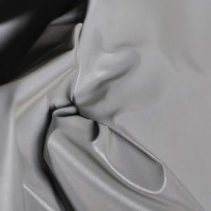 May include: A set of three ceramic mugs with a speckled, matte finish. The mugs are in shades of blue, green, and white. Each mug has a rounded shape and a simple, modern design. Perfect for coffee or tea.