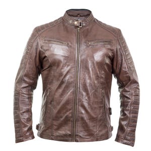 May include: A brown leather jacket with a stand-up collar and a front zipper. The jacket has two zippered chest pockets and quilted detailing on the shoulders and sleeves. The jacket has a classic, vintage style.