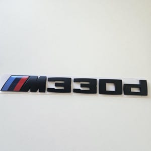 Black matte 330d style emblem for BMW 3 Series models (E30, E36, E46, E90, E91, E92, F30, G20) vehicle lettering tuning accessories