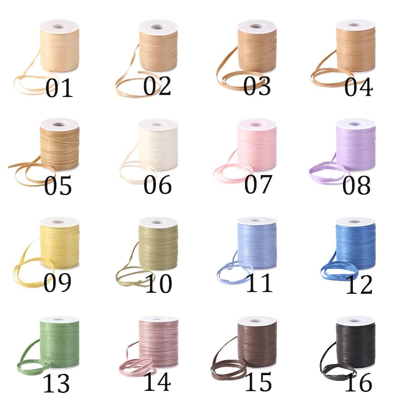 May include: A collection of sixteen spools of decorative ribbon in various colors, including beige, pink, lavender, yellow, green, and blue. Each spool is labeled with a number from 01 to 16.