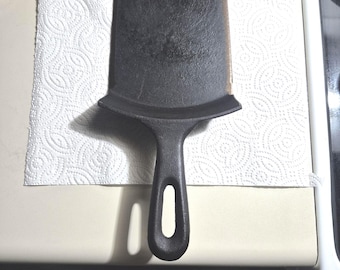 Cast iron spatula. Made from a skillet.