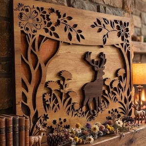 May include: Wooden wall art featuring a deer silhouette within a forest scene. The artwork is laser-cut with intricate floral and tree designs. The piece is displayed above a fireplace, with decorative elements.