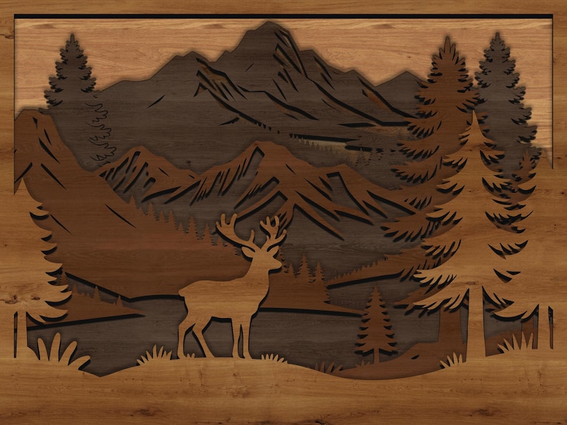 May include: Wooden wall art featuring a layered mountain scene with a deer silhouette. The artwork uses various shades of brown and tan to depict trees, mountains, and a deer in a natural landscape. The piece is framed.