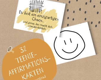 May include: A collection of affirmation cards with German text. One card has a smiley face, another has text on a yellow background. The cards are on a brown background with black dots.