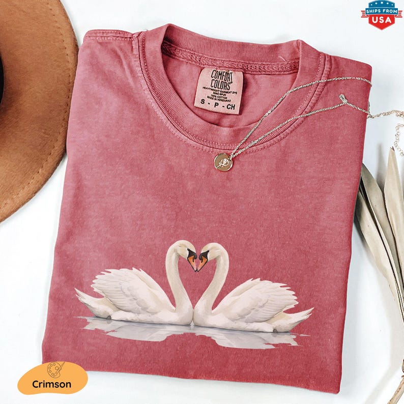 Celebrate love this Valentine's Day with our Comfort Colors® White Swans Shirt – the perfect romantic gift for couples! Featuring an elegant illustration of two swans forming a heart, this love shirt captures the timeless symbol of romance and devotion. Whether you're gifting it to your special someone or treating yourself, this sweatshirt is a cozy way to showcase your love story.