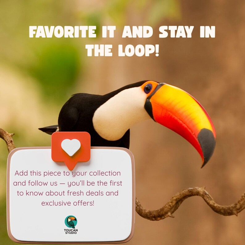 May include: A toucan with a large orange, yellow, and black beak sits behind a white sign with rounded corners. The sign features a red heart icon and text that reads: FAVORITE IT AND STAY IN THE LOOP! Add this piece to your collection and follow us.