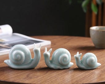 Figura de familia de caracoles de cerámica azul celadón, decoración artesanal para el hogar con propiedades curativas.