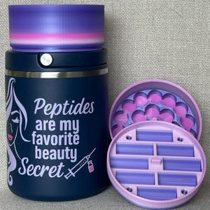 May include: A navy blue tumbler with the text "Peptides are my favorite beauty Secret" and a graphic of a woman's face and a syringe. The tumbler has a purple and pink lid. A separate container with a purple and pink lid is also shown.