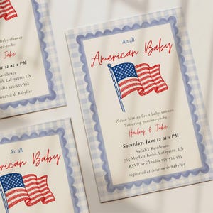 Three All American Baby shower invitations fanned out in a flat lay showing the full red white and blue design with American flag illustration, scallop border detail