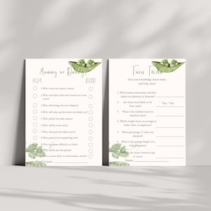 May include: Two baby shower game cards with green pea pod illustrations. One card is titled "Mommy or Daddy?" and the other "Twin Trivia." The cards have questions about babies and twins, with space for answers.