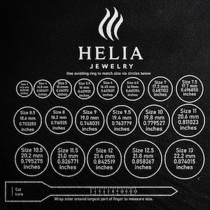 May include: Black and white ring size guide with the Helia Jewelry logo. The guide includes sizes from 3 to 13, with measurements in millimetres and inches. A paper sizer is at the bottom to measure finger size.