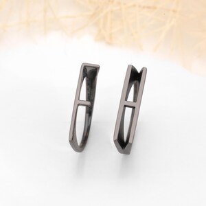 Add a personal touch to your jewelry collection with this Personalized Initial Stackable Ring, designed to reflect your unique connection with loved ones. This romantic initial band ring can be customized with the initials of your partner, making it the perfect couples letter ring for celebrating your love. Whether you choose 925K sterling silver, gold-plated, rose gold-plated, black rhodium-plated, or 14K solid gold, this ring is a timeless piece that adds meaning to your everyday style.