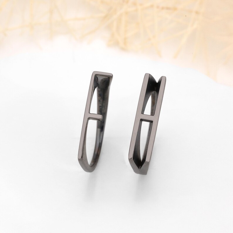 Add a personal touch to your jewelry collection with this Personalized Initial Stackable Ring, designed to reflect your unique connection with loved ones. This romantic initial band ring can be customized with the initials of your partner, making it the perfect couples letter ring for celebrating your love. Whether you choose 925K sterling silver, gold-plated, rose gold-plated, black rhodium-plated, or 14K solid gold, this ring is a timeless piece that adds meaning to your everyday style.