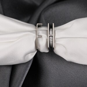 Add a personal touch to your jewelry collection with this Personalized Initial Stackable Ring, designed to reflect your unique connection with loved ones. This romantic initial band ring can be customized with the initials of your partner, making it the perfect couples letter ring for celebrating your love. Whether you choose 925K sterling silver, gold-plated, rose gold-plated, black rhodium-plated, or 14K solid gold, this ring is a timeless piece that adds meaning to your everyday style.