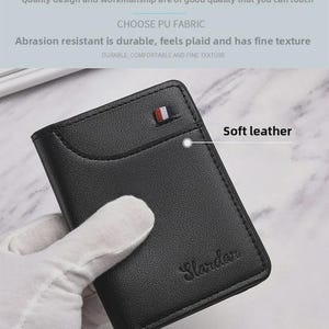 May include: A black leather wallet with a small red, white, and blue accent. The wallet has the word "Slardar" embossed on the front. The image also includes the text "Soft leather" and "Choose PU fabric".