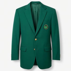 May include: A dark green blazer with a two-button closure and a notched lapel. The blazer features a patch on the chest with a green and gold emblem. The jacket has two front pockets and gold buttons. The blazer is a classic style.