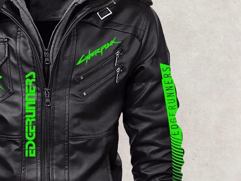 May include: Black faux leather jacket with a gray hooded insert. The jacket features the neon green text "Cyberpunk" and "EDGERUNNERS". The sleeves have green stripes and the text "EDGERUNNERS".