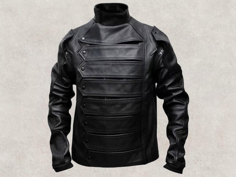 May include: Black leather jacket with a high collar and multiple horizontal panels across the chest. The jacket has a unique design with button and zip details, and a tailored fit. The sleeves are long and fitted.