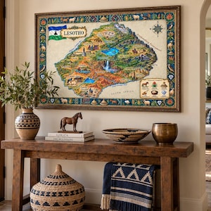 May include: A rectangular wall map of Lesotho featuring a colorful illustrated landscape, the national flag, a compass rose, and a legend of symbols. The map is enclosed in a dark ornate frame and displays various geographical landmarks and text.