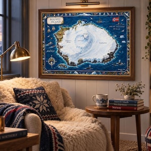 May include: A framed map of Bouvet Island featuring a central white glacier surrounded by deep blue ocean waters, detailed with nautical illustrations, a compass rose, and the Norwegian flag, displayed on a wall above a cozy armchair.